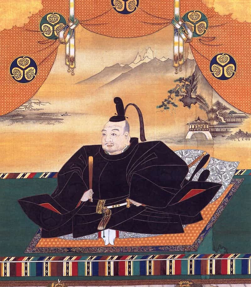 Portrait painting of Tokugawa Ieyasu seated in formal black court robes, surrounded by the Tokugawa hollyhock clan crest